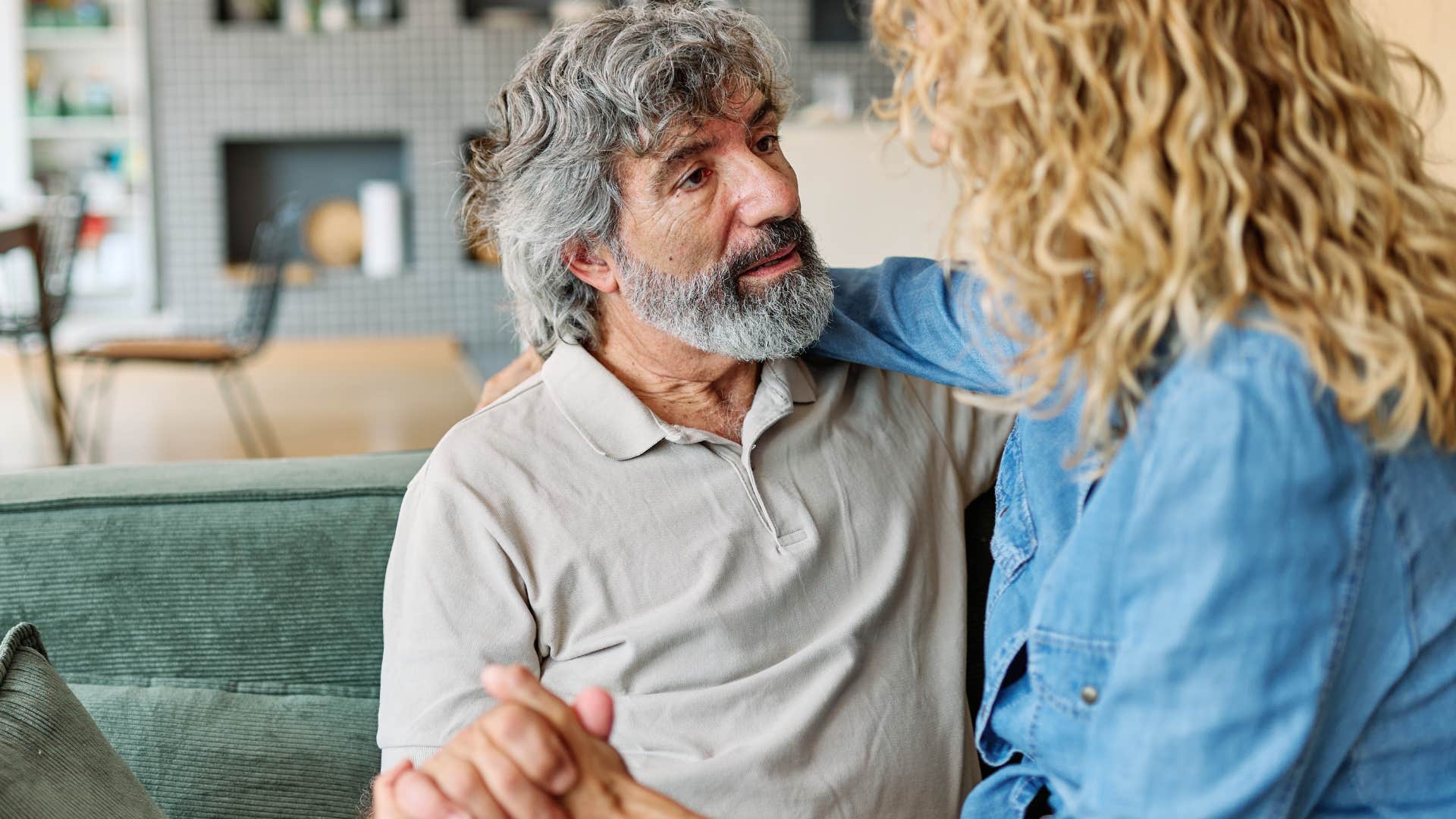 older couple who plans dates often cuddling at home