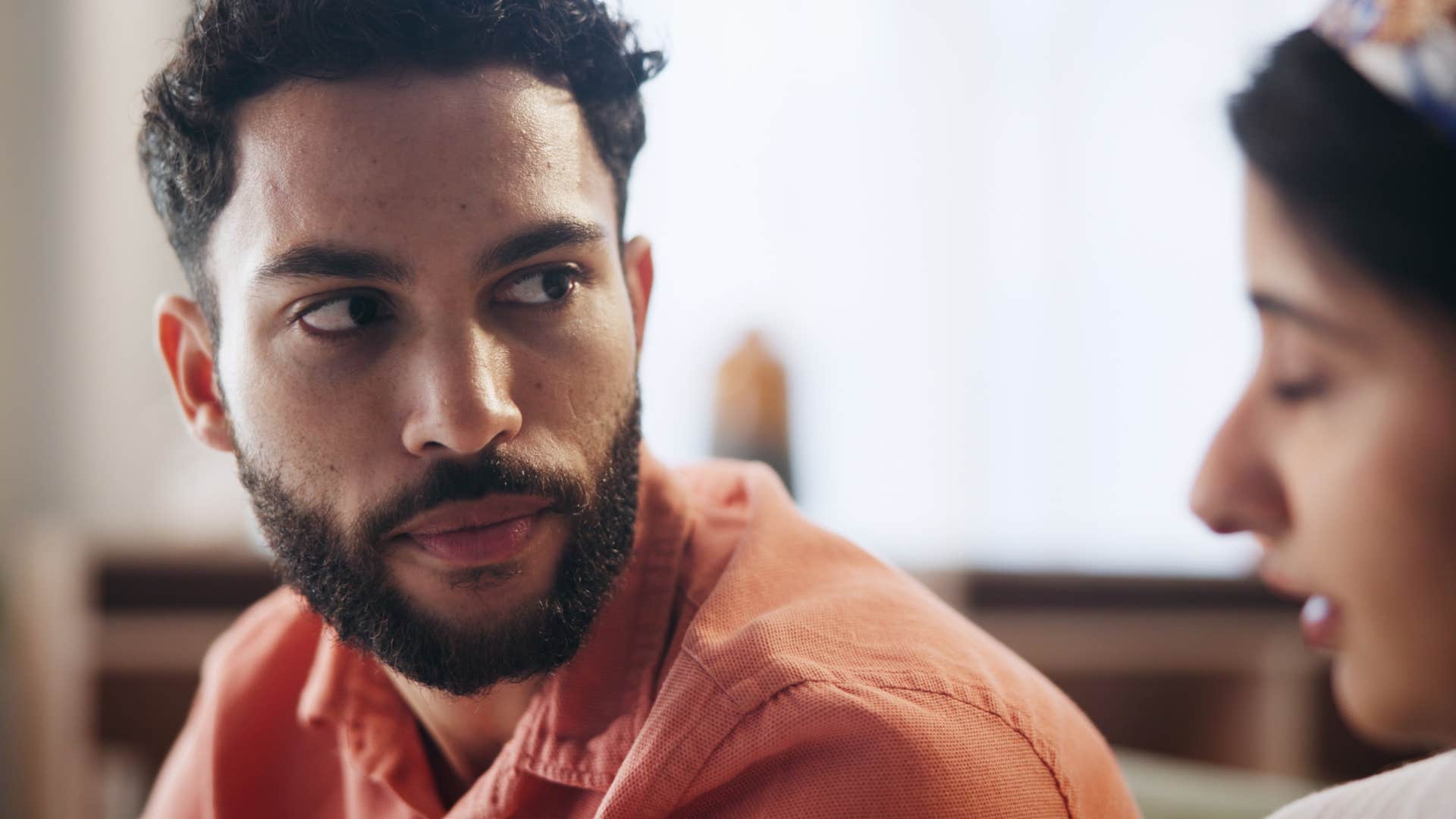 uneducated man saying that makes no sense to his partner