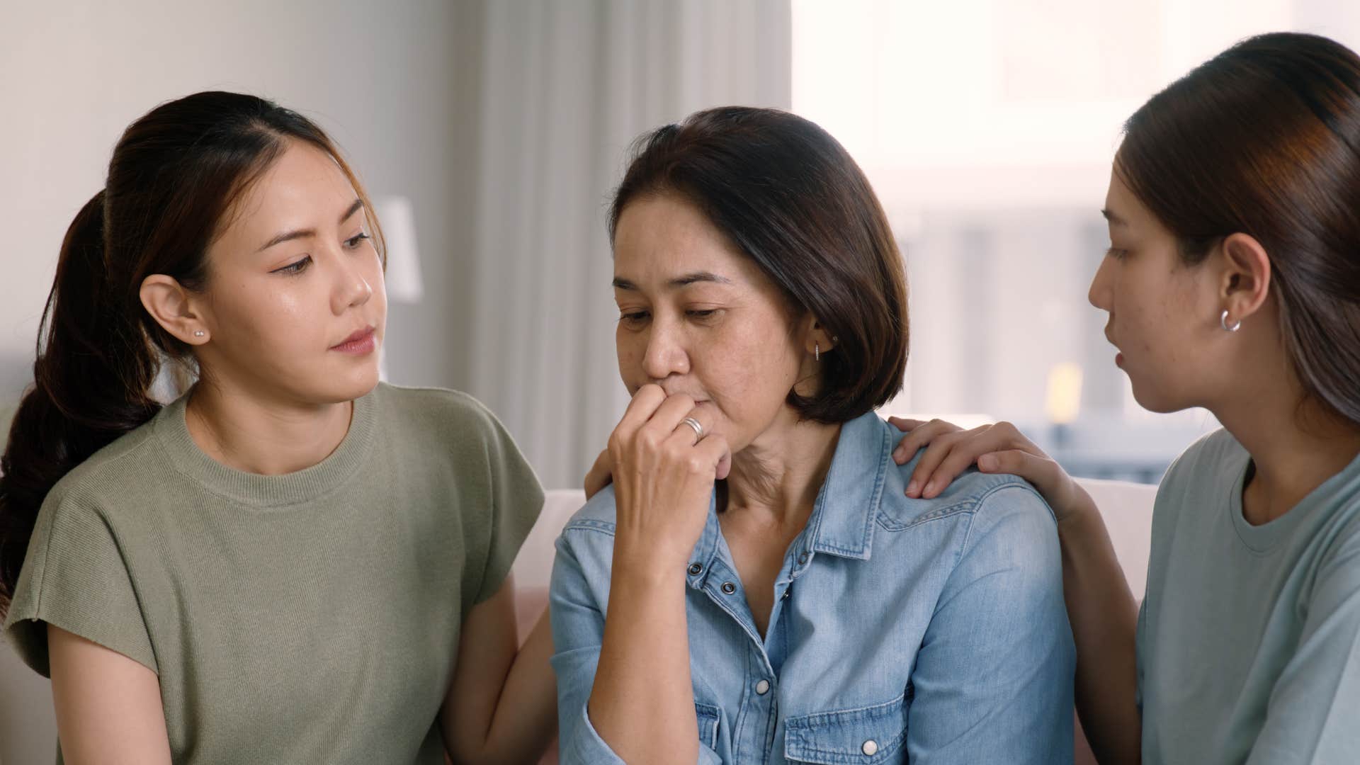 Upset person supported by family showing habit of asking for help