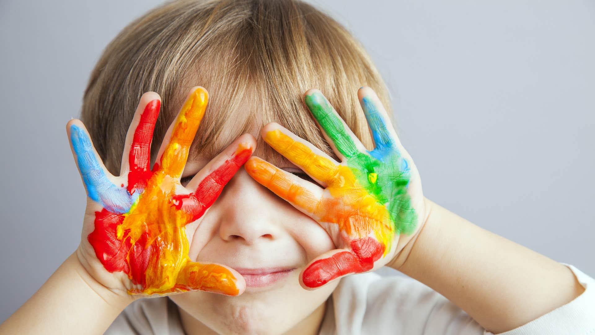 Messy boy with paint on hands