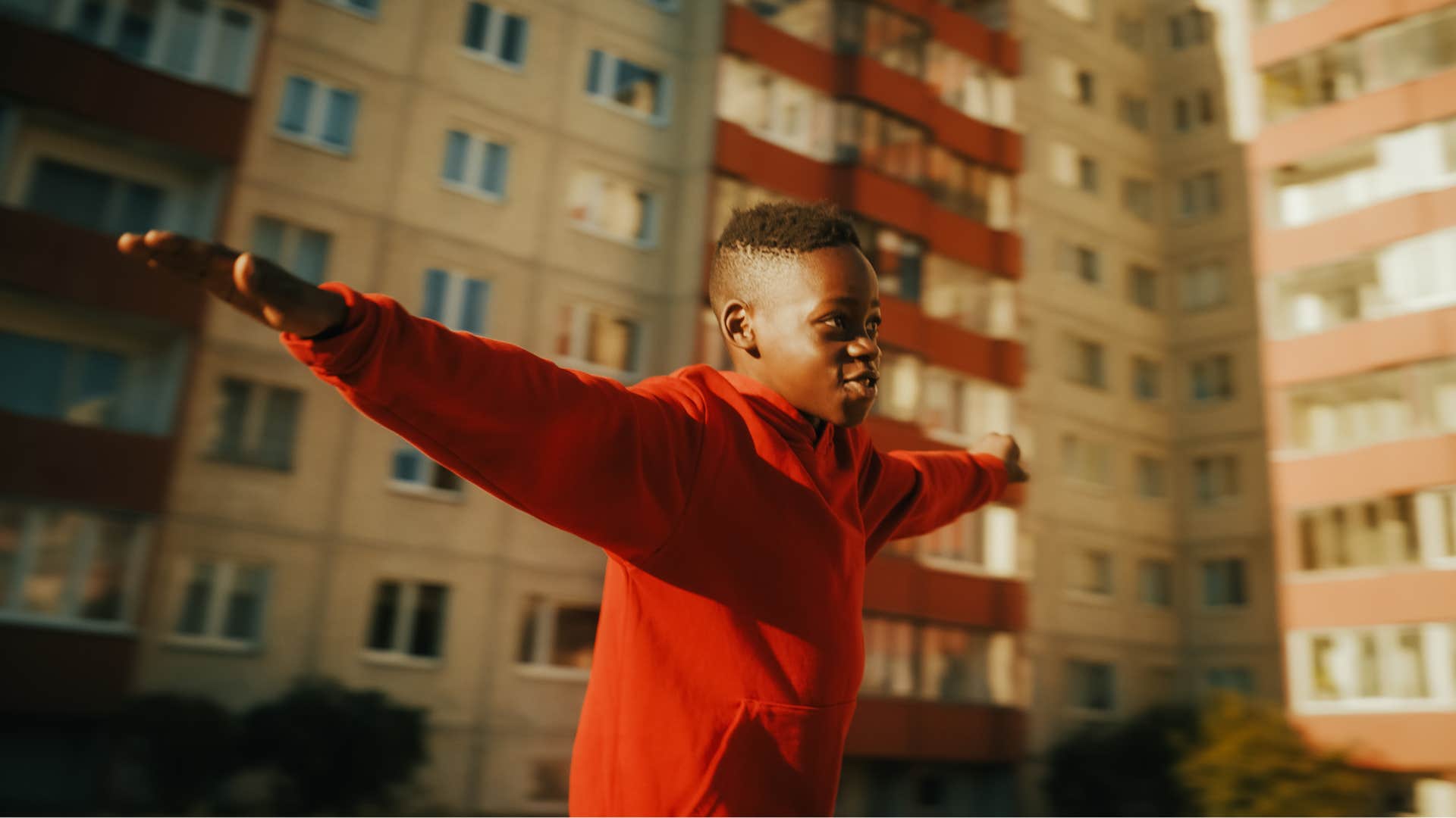 Excited boy plays airplane