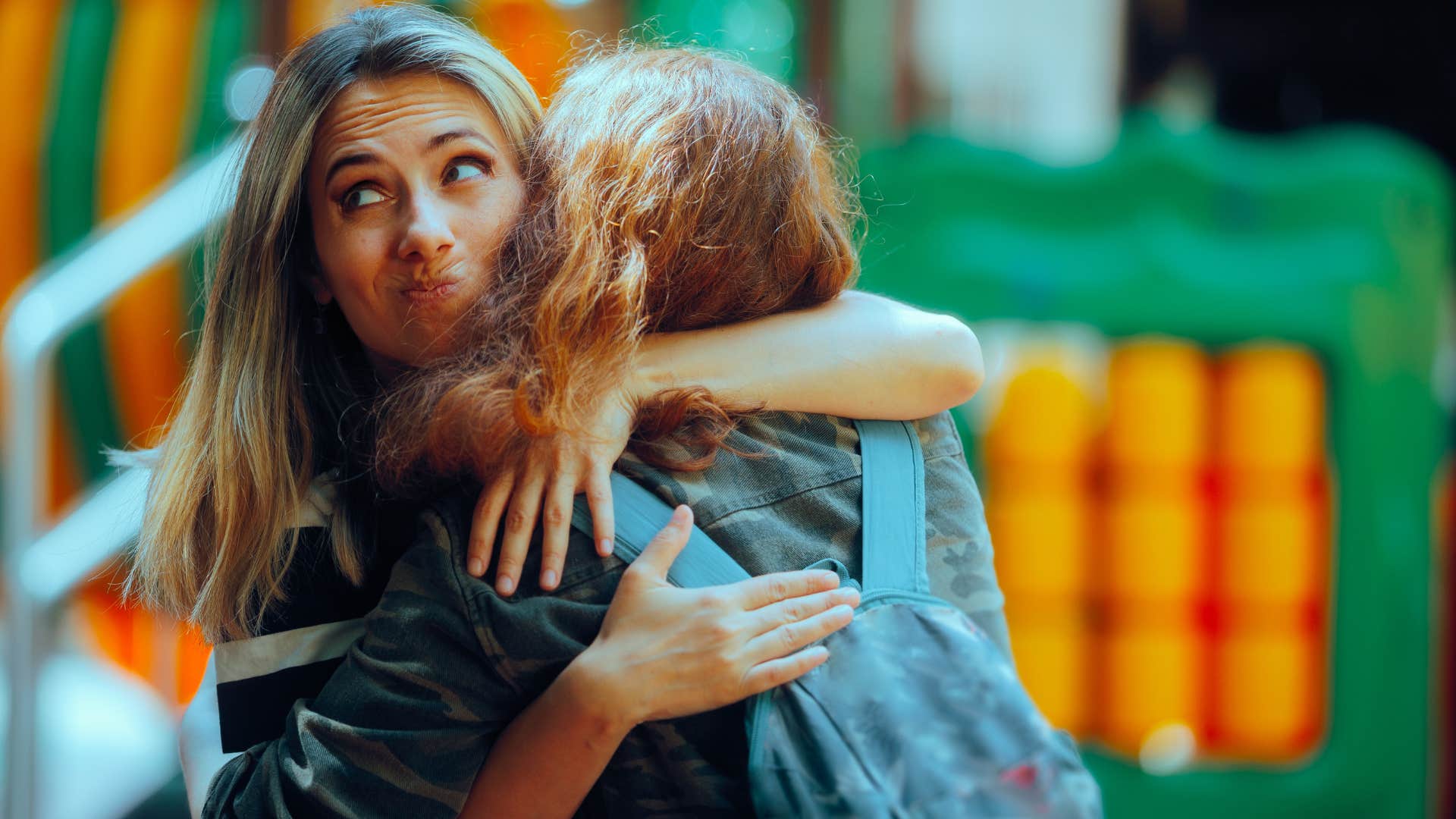 woman hugging friend hating being around fake people
