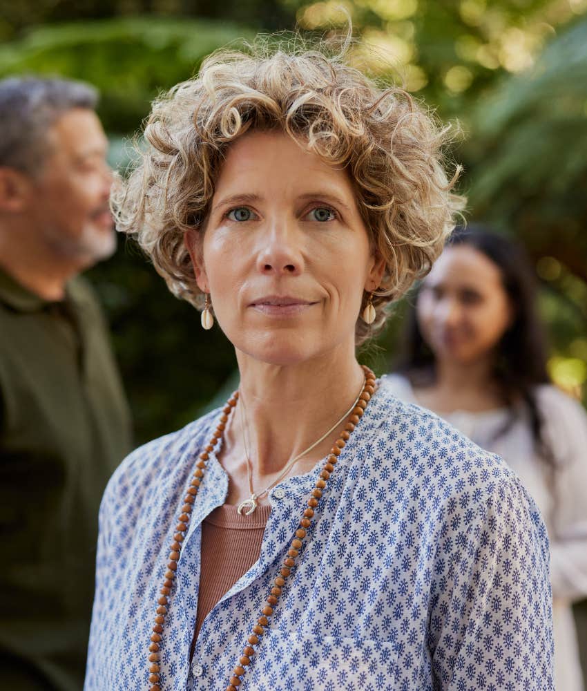 slightly uncomfortable person in group showing introverted extrovert