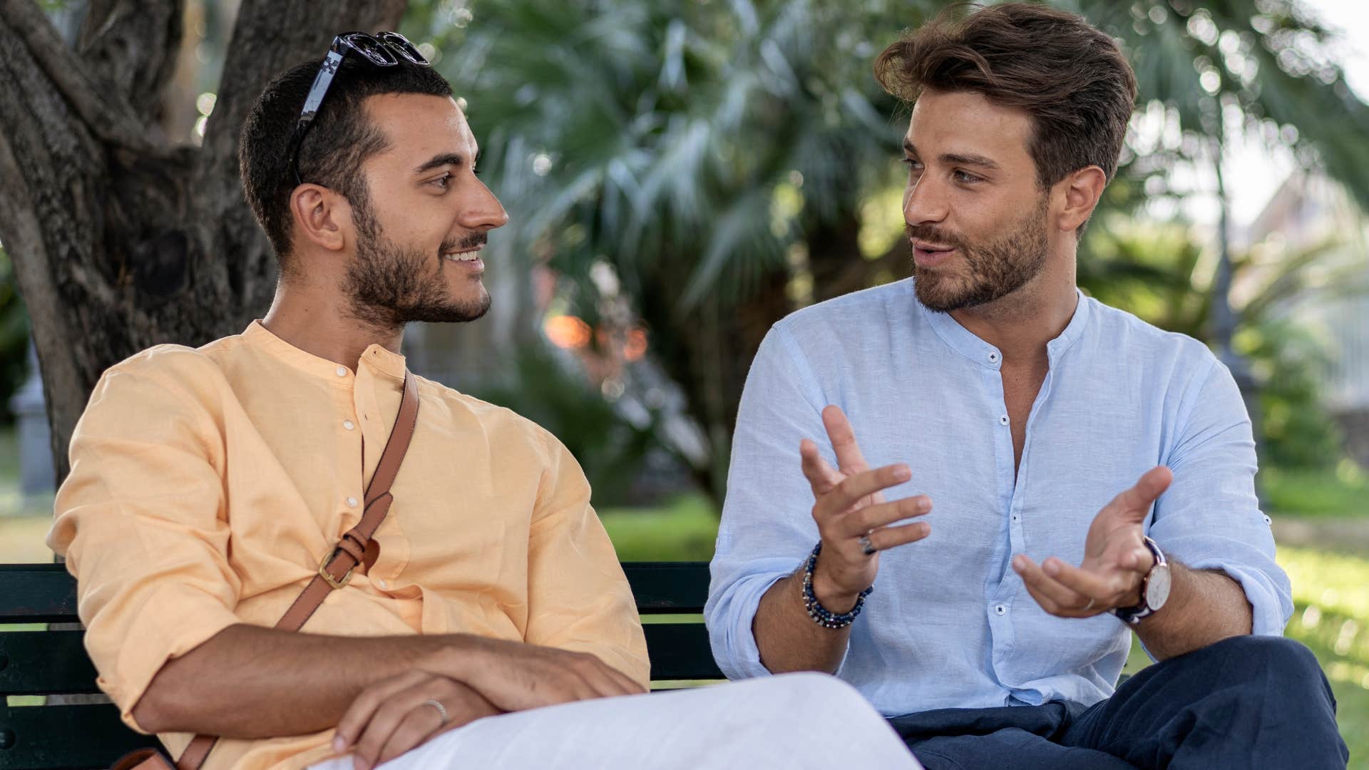 man asking thoughtful questions to friend outside