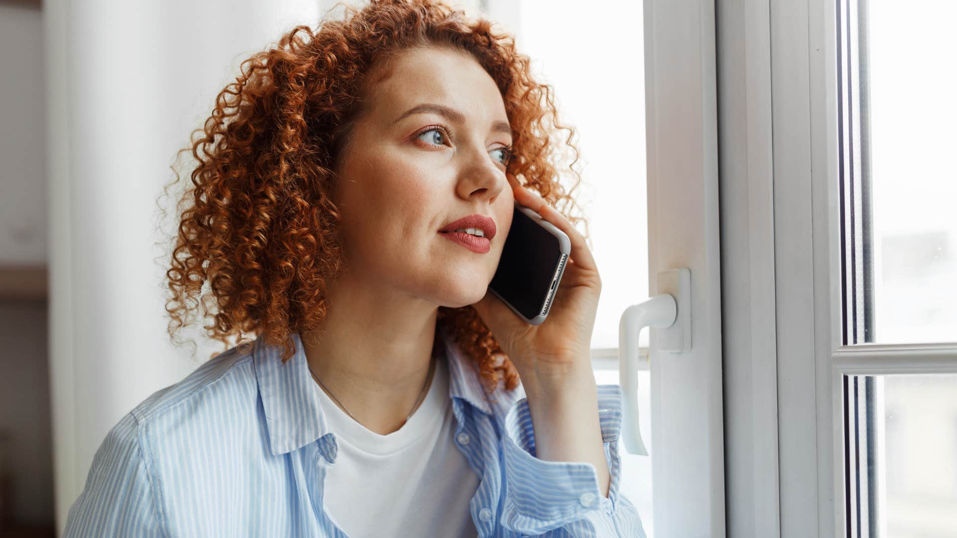 introverted woman on the phone not saying yes to everything she's asked