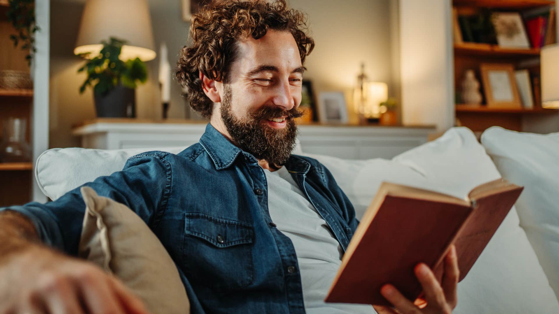 introverted man personalizing his routine reading at home