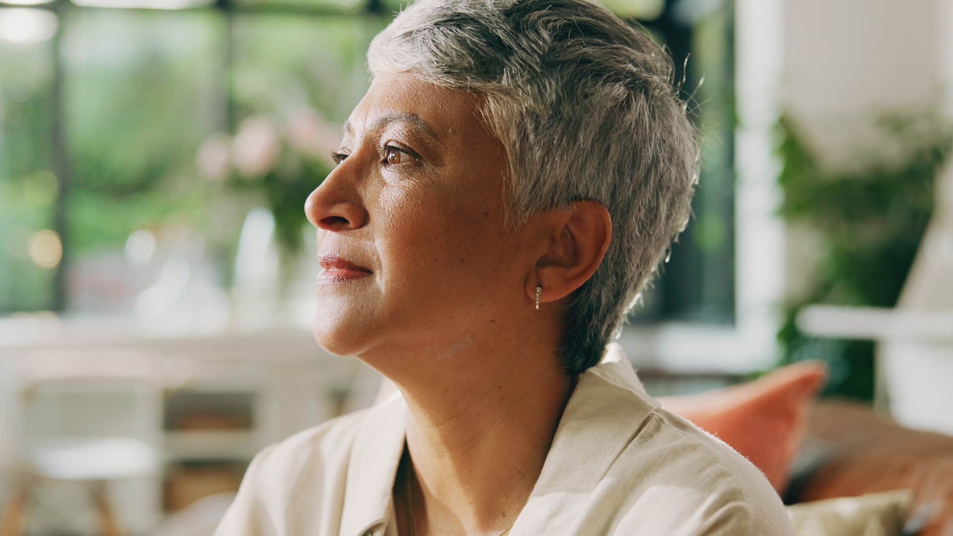 self-aware and reflective introverted woman at home