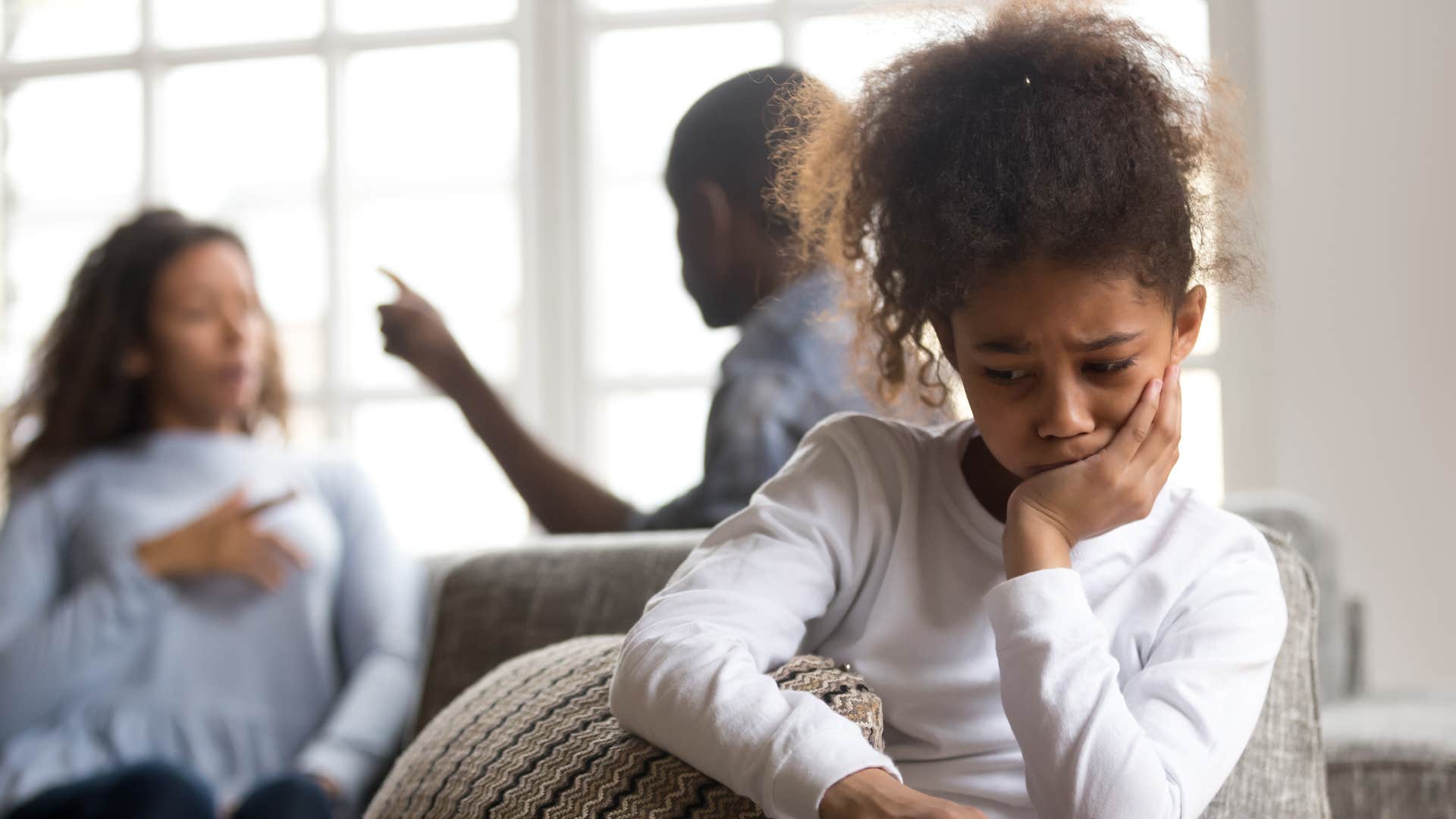 little girl not experiencing any fun moments with her arguing parents