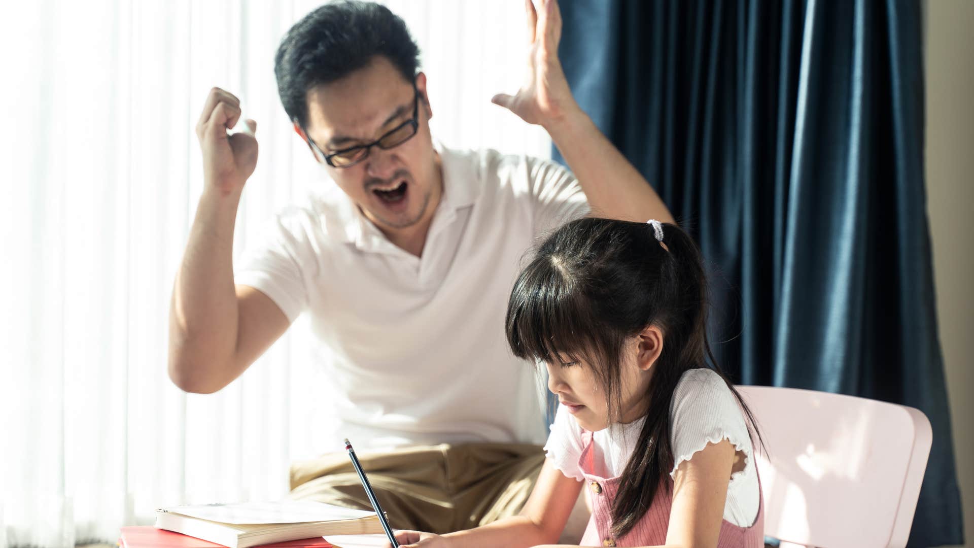 little girl feeling unloved as father yells at her