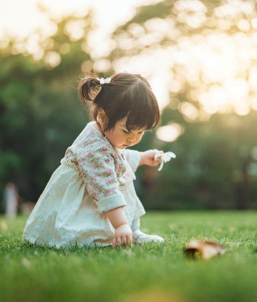 Enthralled child explores nature showing life lesson