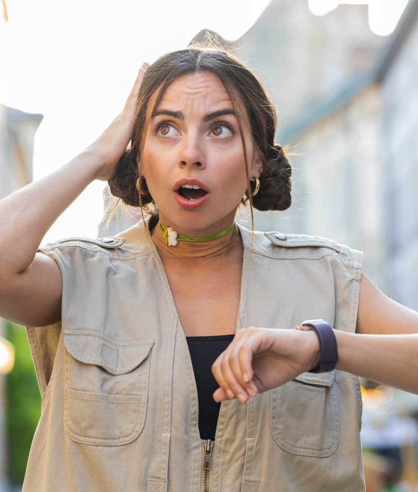 Nervous person checks watch showing anxiety made her forget date