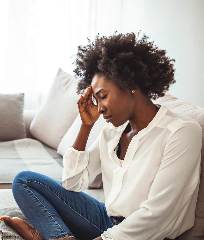 upset person touches forehead showing effect of disease diagnosis