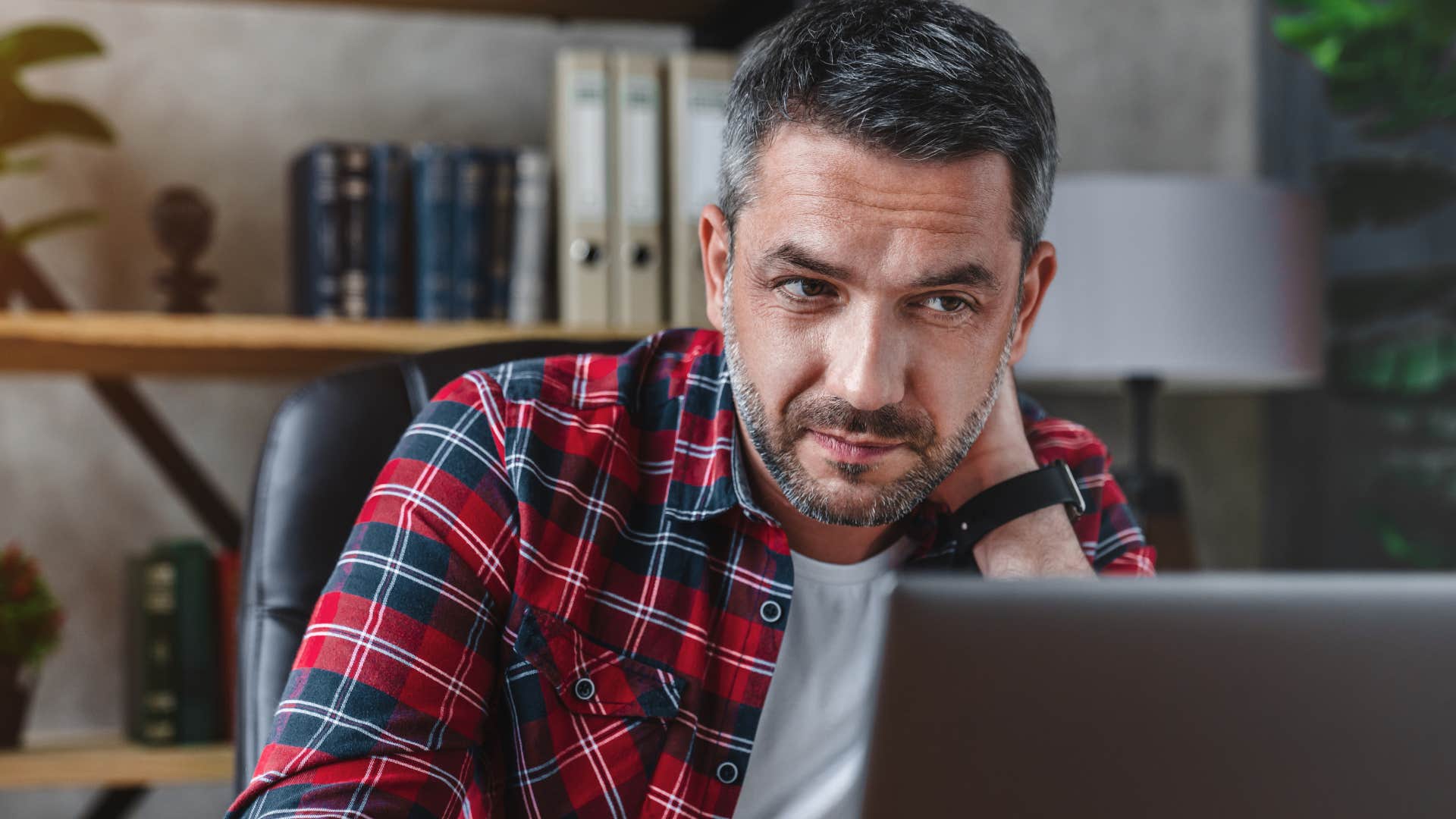 Man who doesn't tolerate ignorance sitting at work.