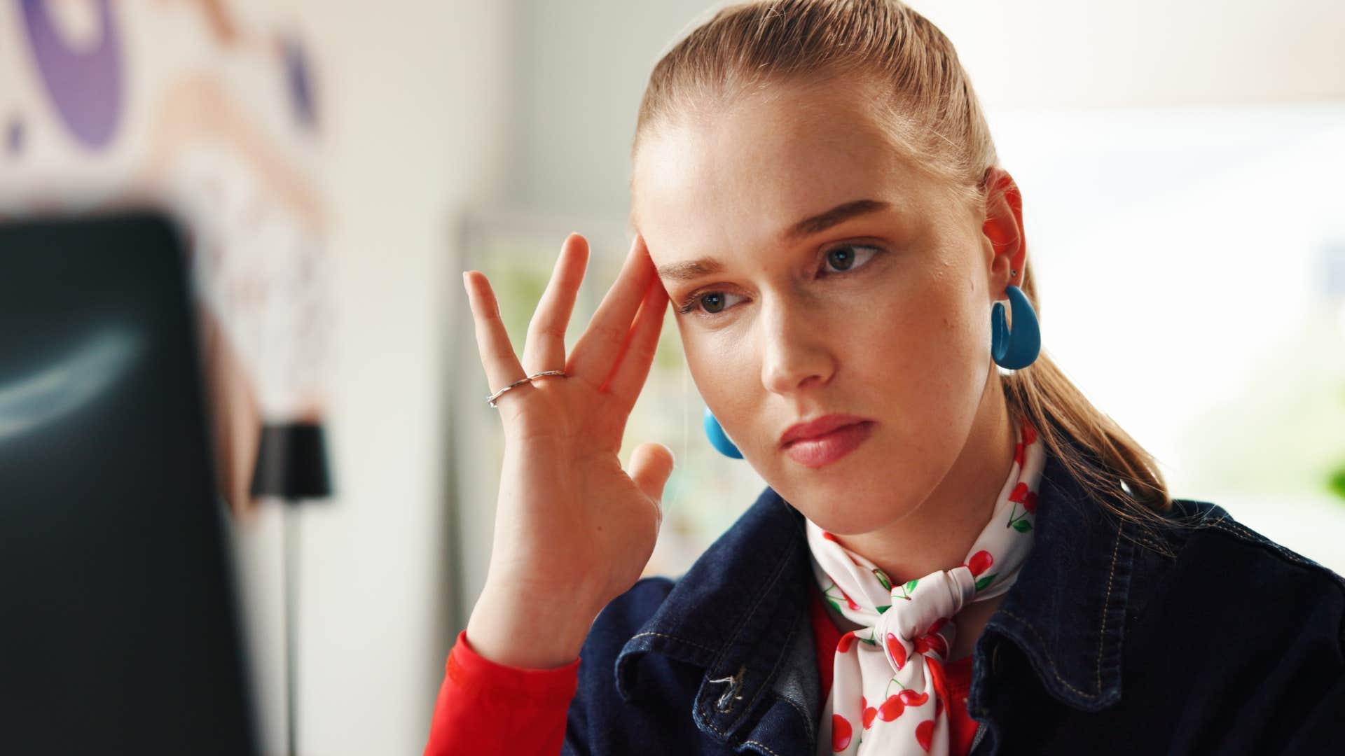 Woman who's often misunderstood by others sitting at work.