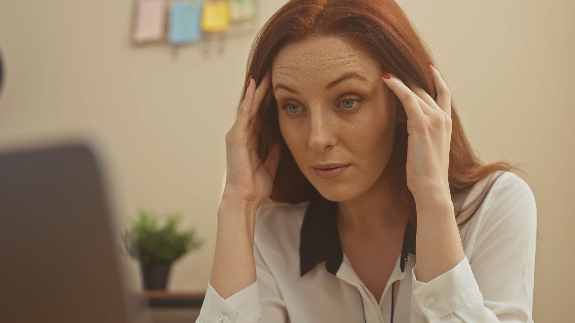 Pessimistic woman looking annoyed at work.