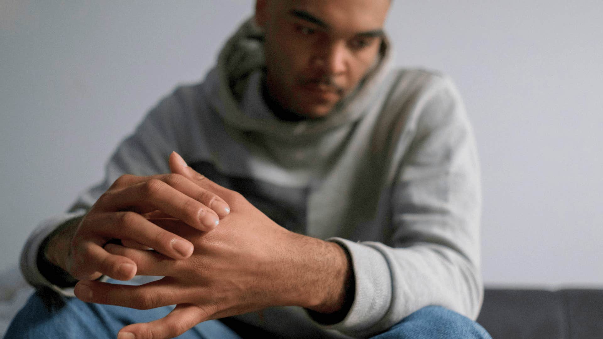 man having a quiet moment alone thinking about relationship with step children