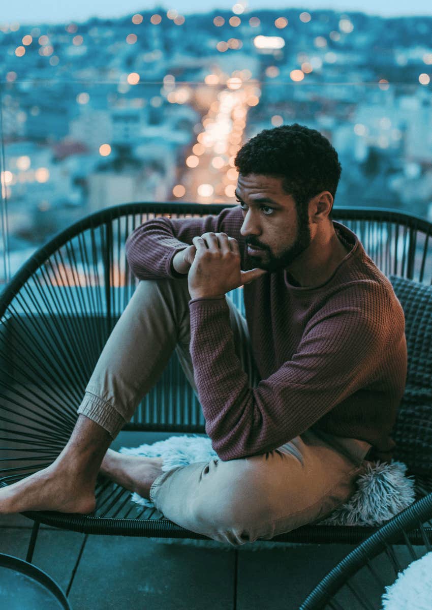 man sitting alone thinking about whether someone is right for them