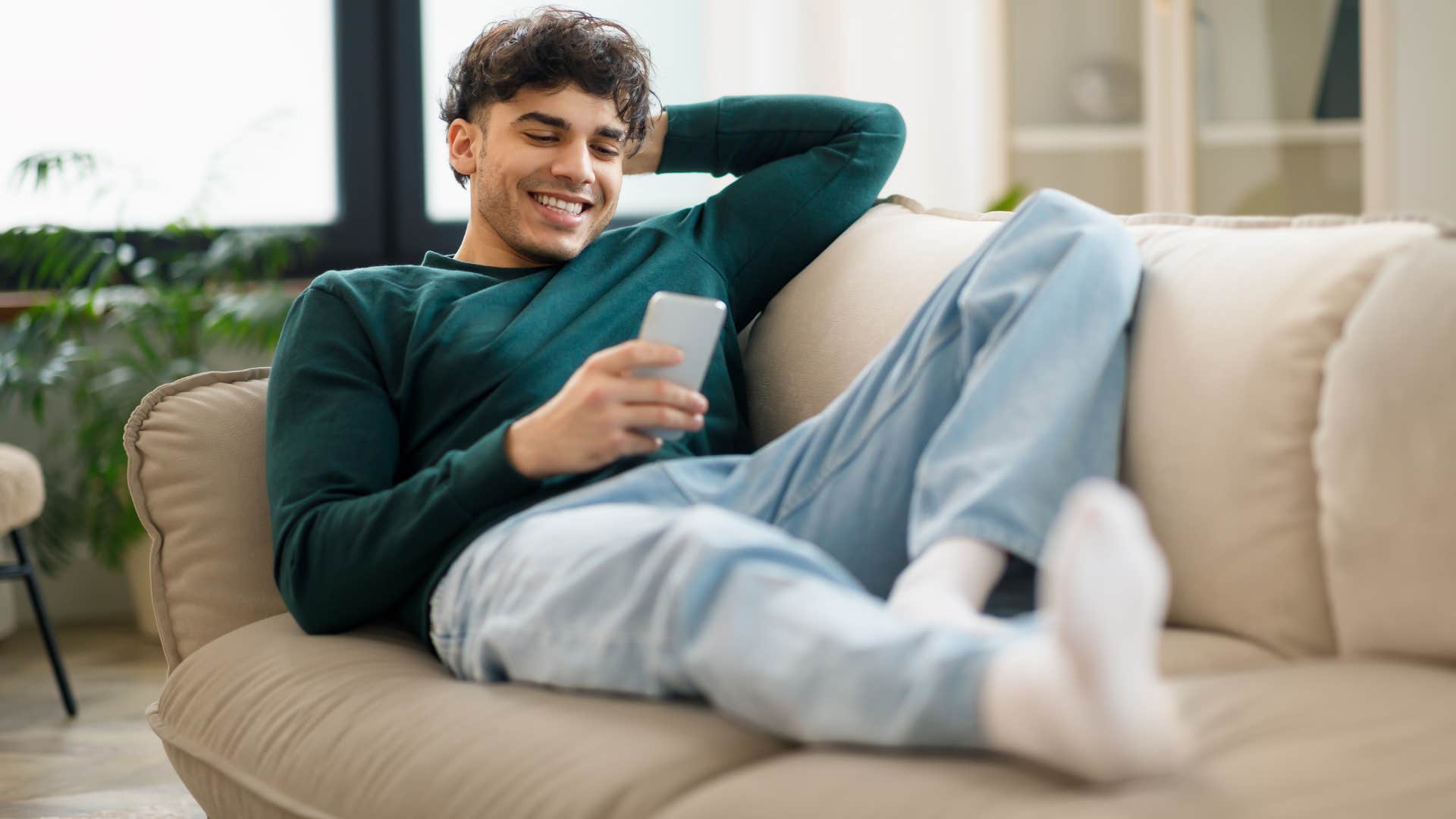 man with a low need for social stimulation sitting at home alone