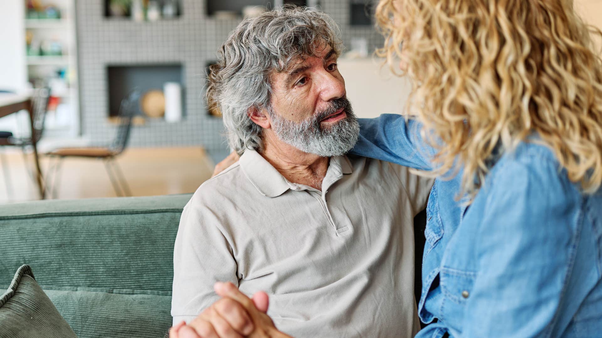 Man saying "I'm here" to his wife.