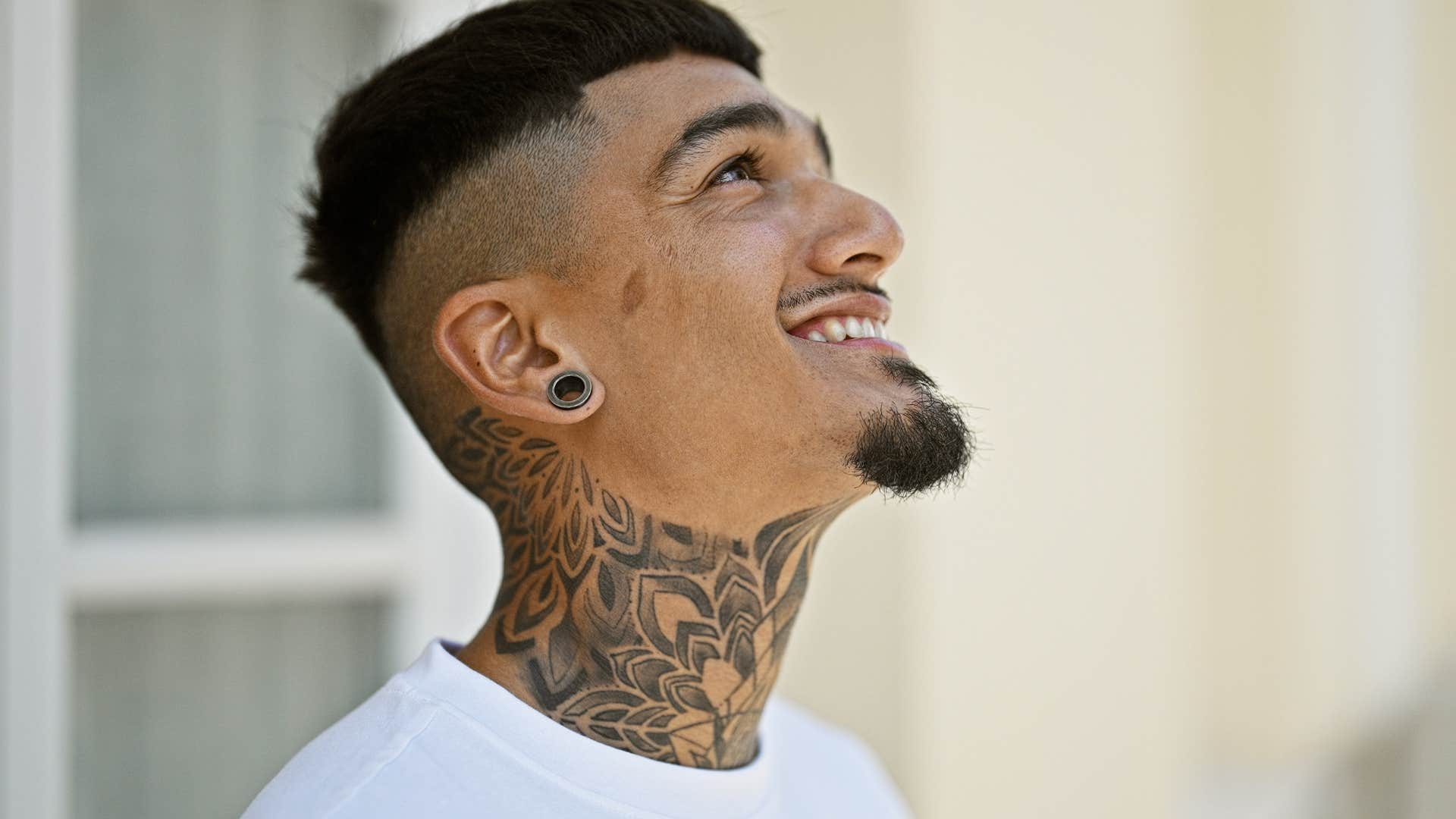 smiling man who cares more about experiences than material things