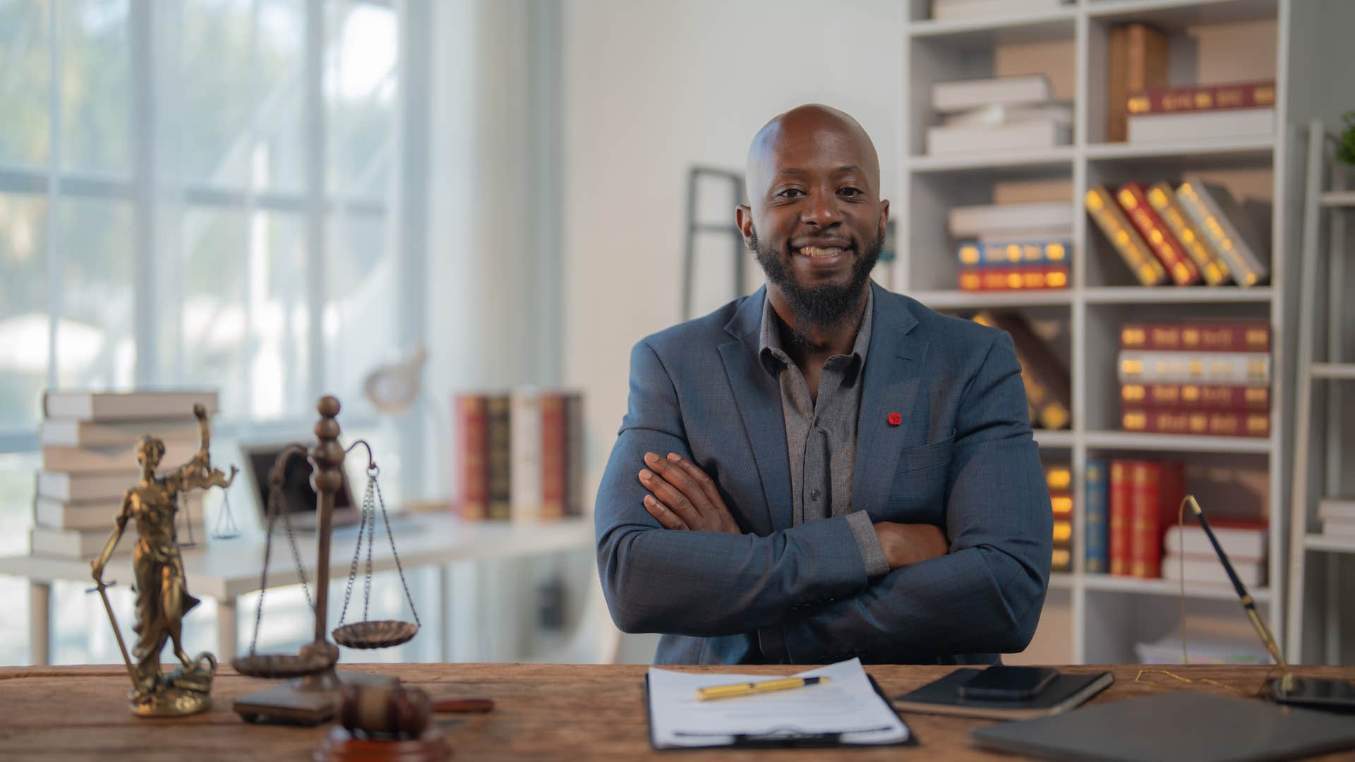 man with a strong sense of identity sitting at his desk