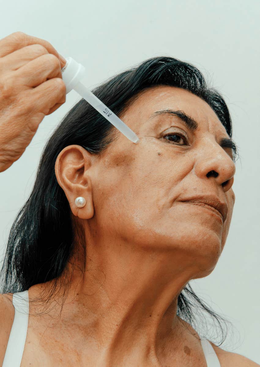 middle age woman doing her skin care routine