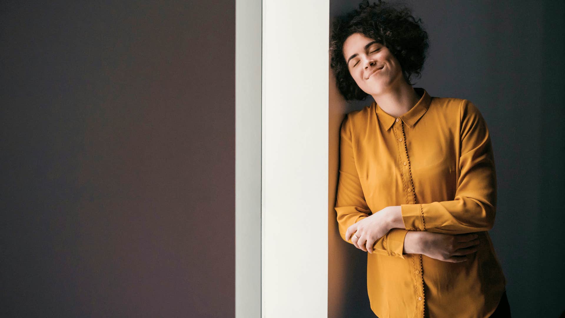mom taking a deep breathe in the doorway for time out