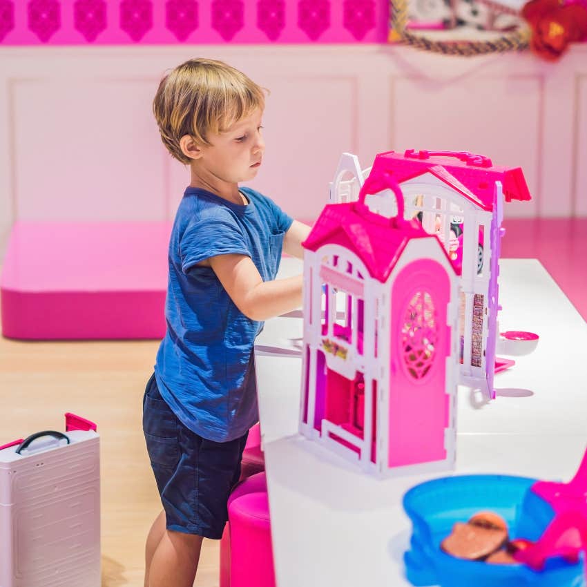 boy playing with dolls because his mom didn't tell him not to