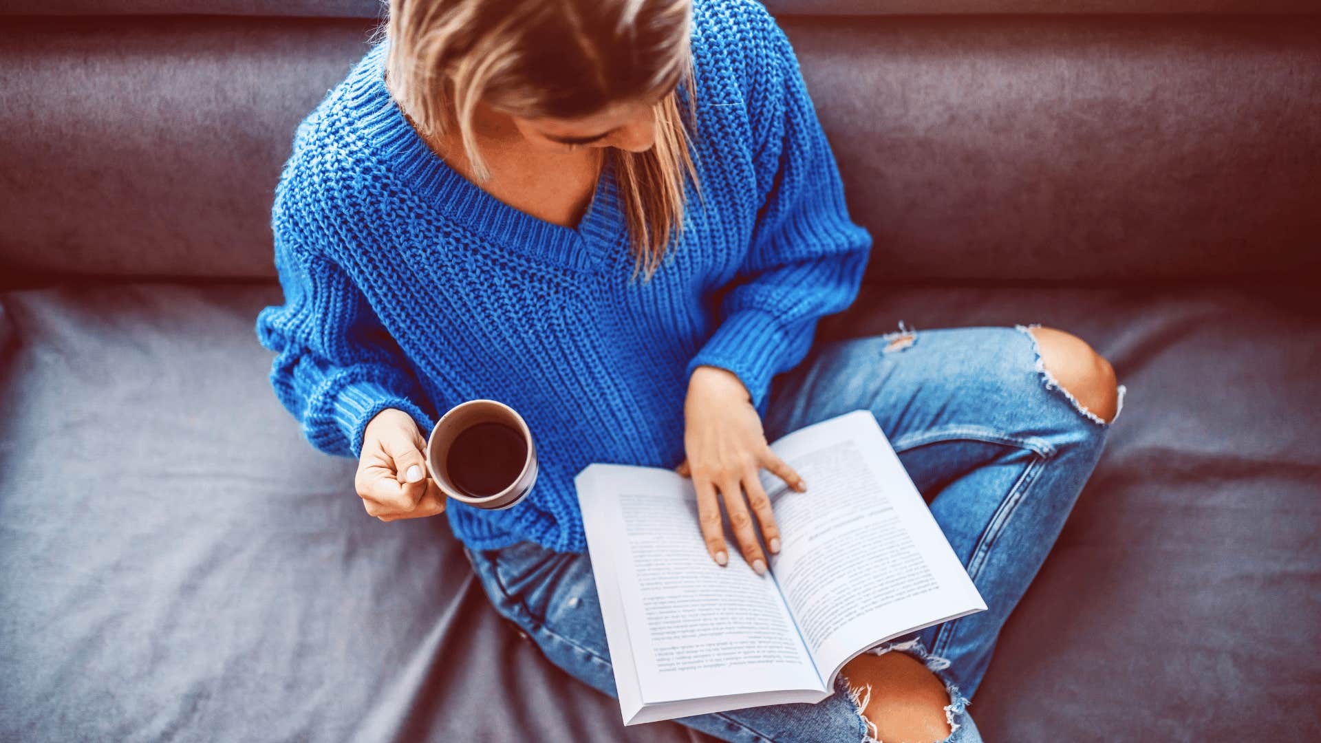 mom practicing self care drinking coffee with book