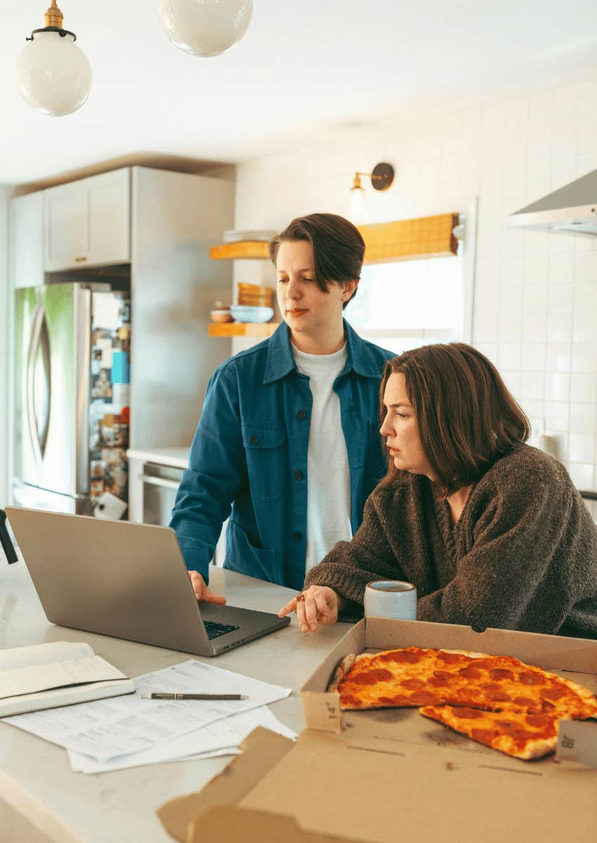 mom and teenage son talking in the kitchen