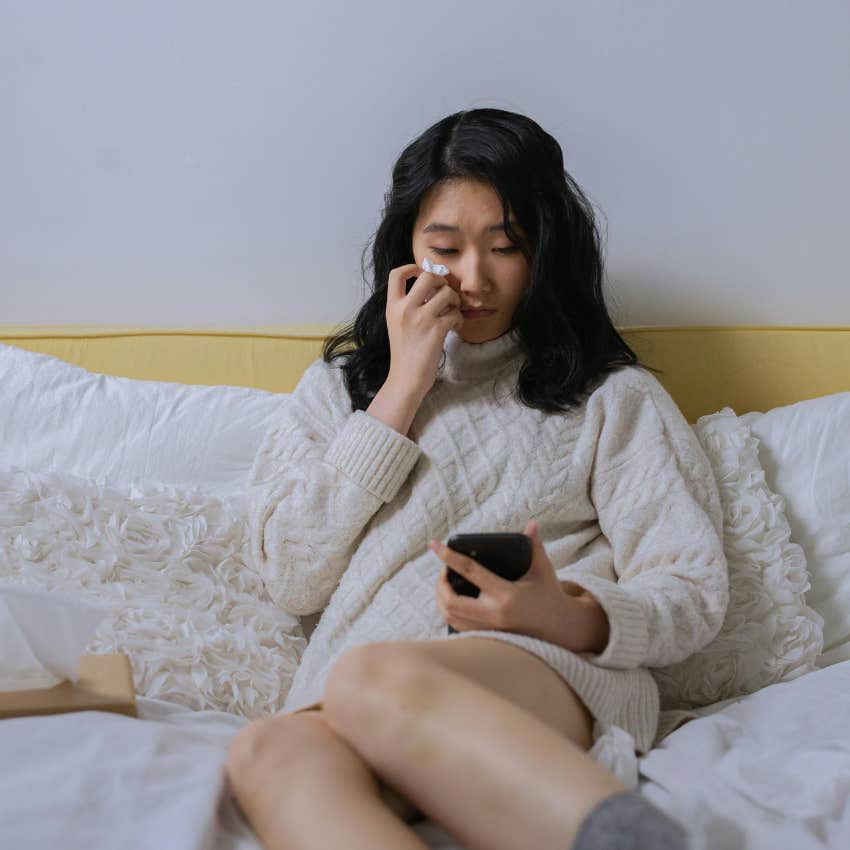 mom who miscarried crying looking at her medical bill