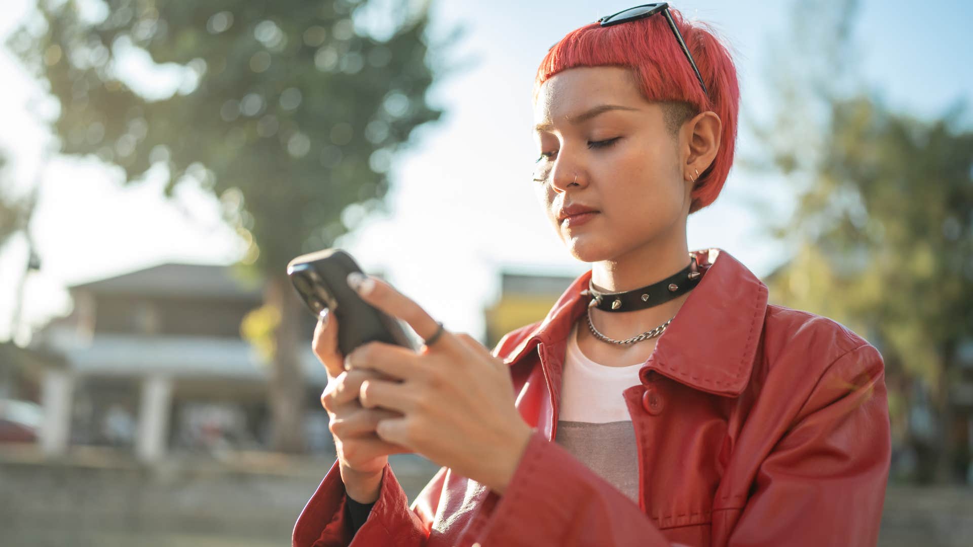 Gen Z woman with a hyper-curated aesthetic looking at her phone