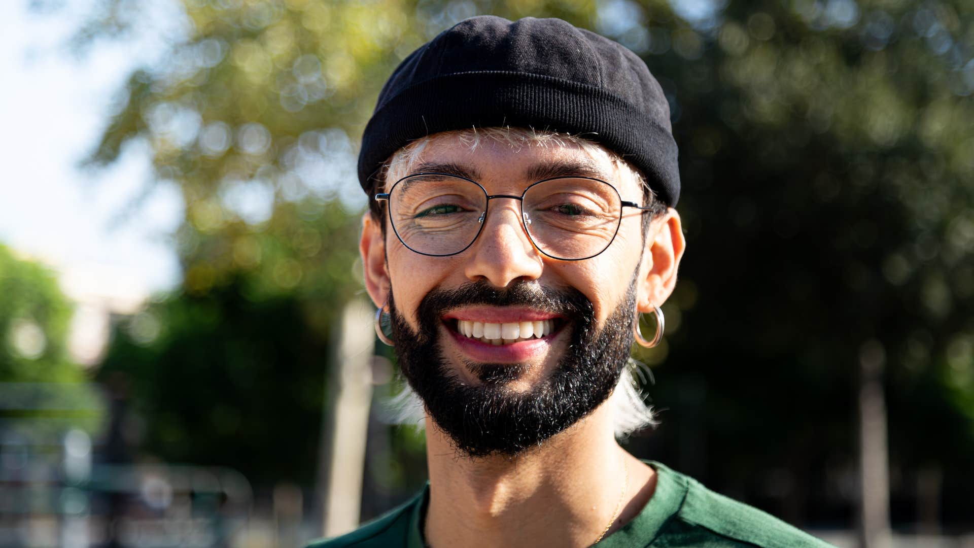 gen z man smiling and laughing turning everything into a joke