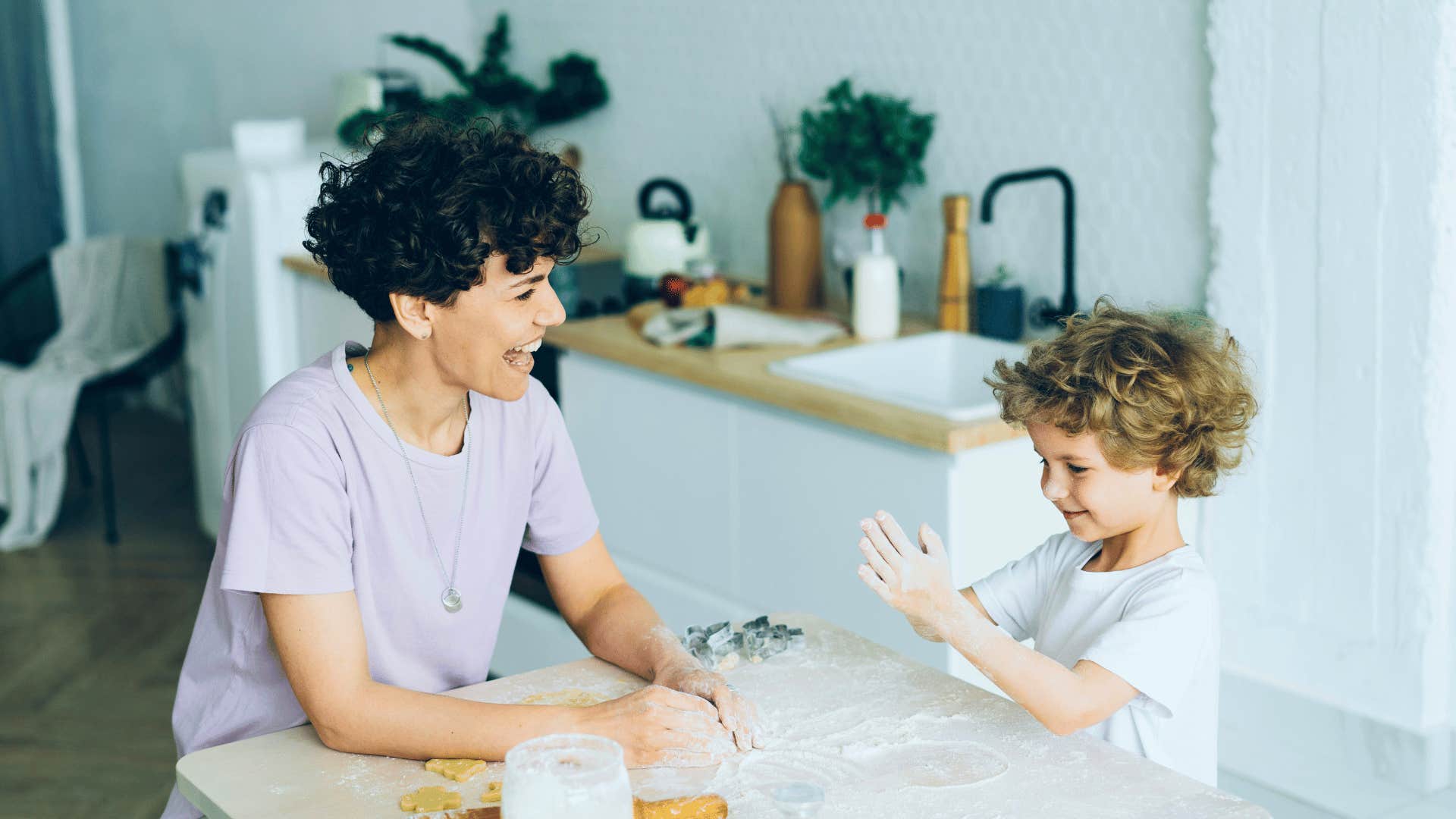 mother and son talking at kitchen table