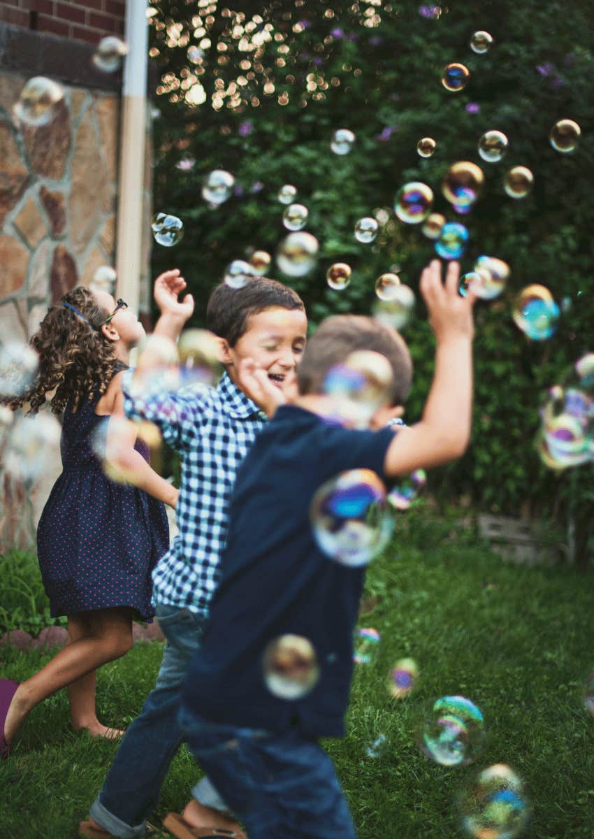 neighborhood kids playing with bubbles