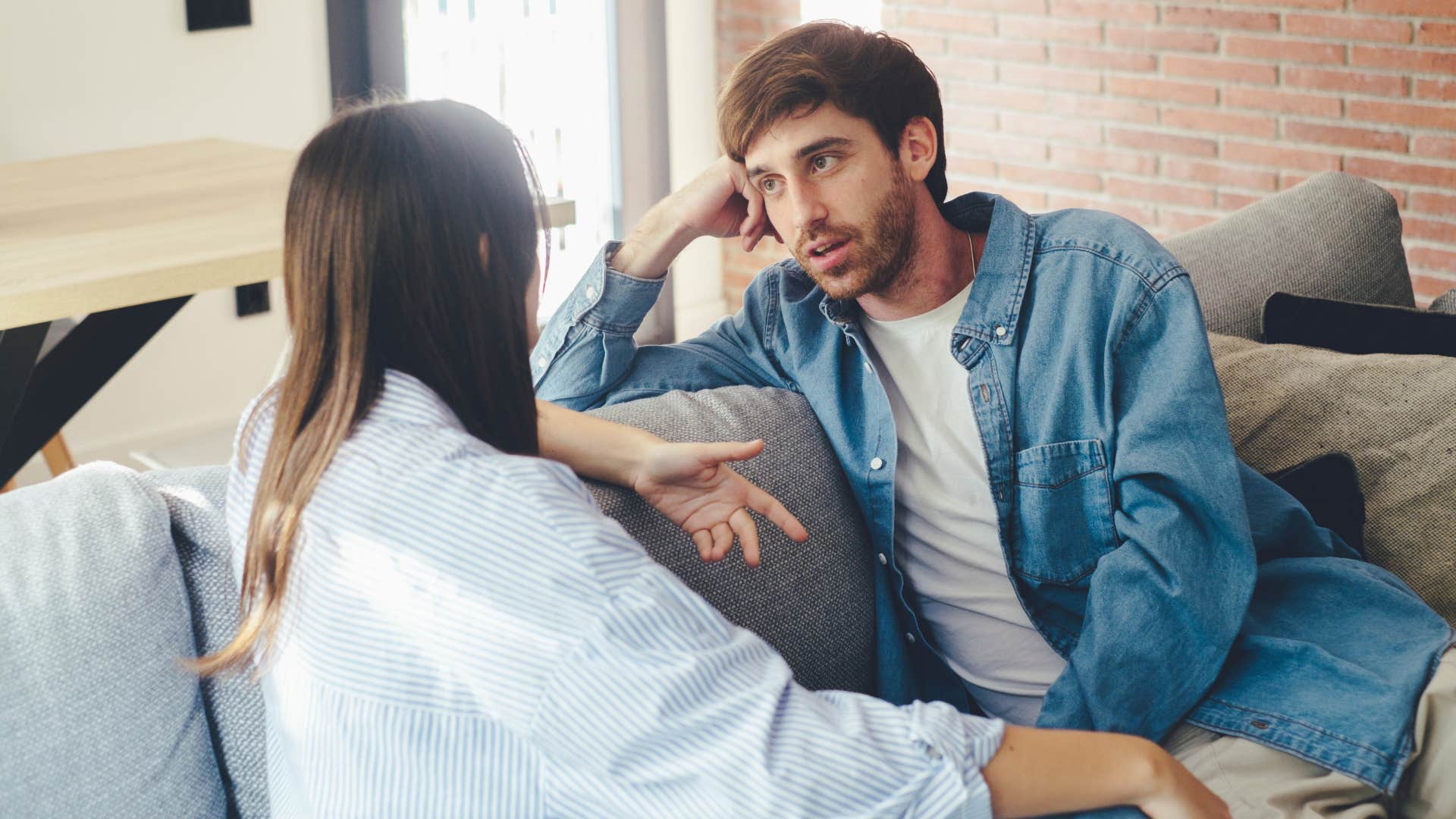 man listening to woman intensely as she says i'd rather meet you honesty than lose myself quietly