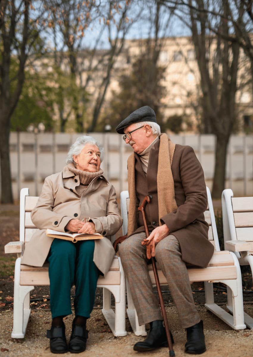older couple sitting outside enjoying their empty nest