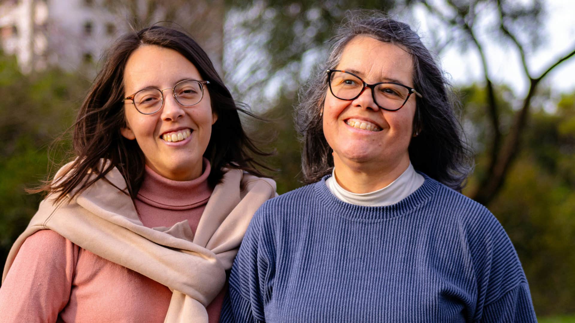 happy older and younger woman showing whose opinion matters