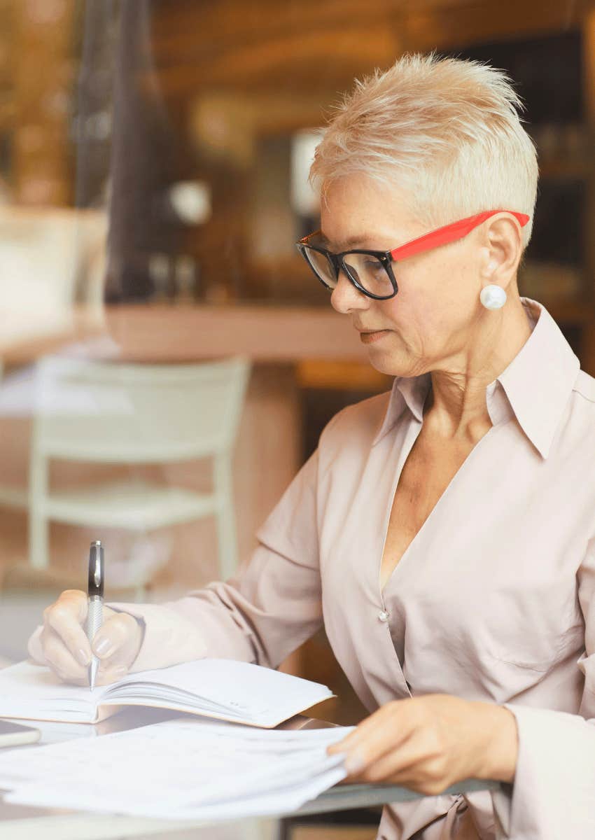 older woman journaling to help when it's hard to stay positive