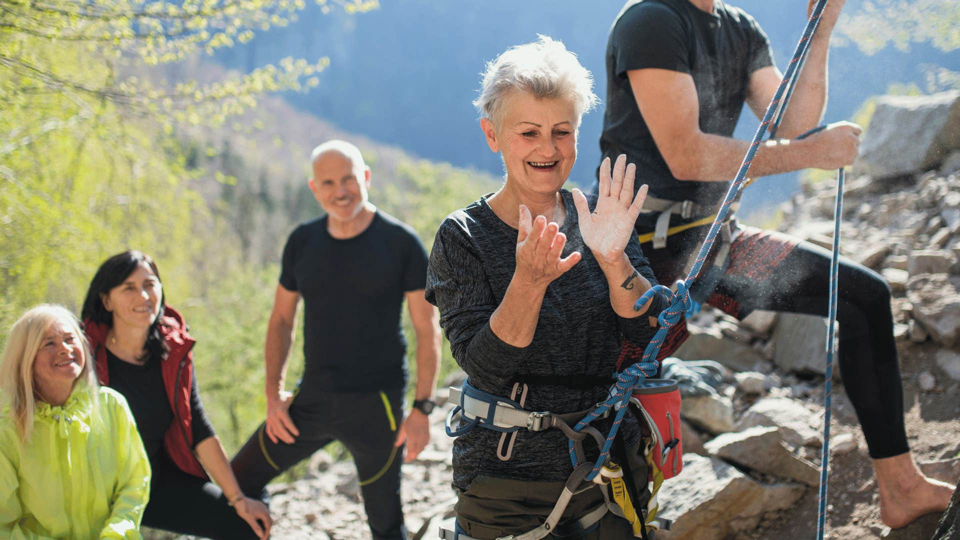 older woman rock climbing regretting choosing safety over risk