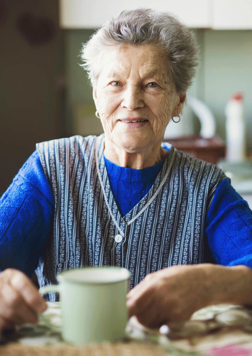 older woman sitting at a dining table