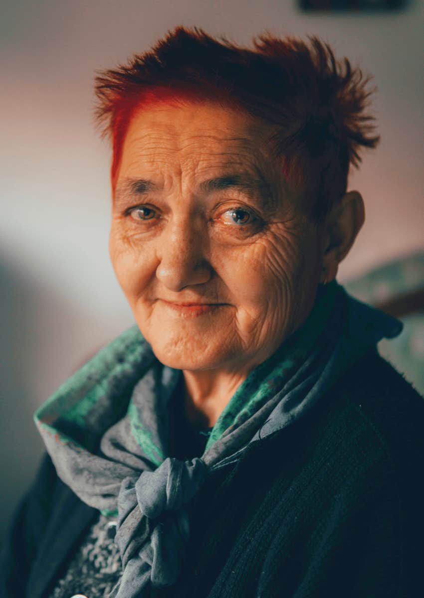 older woman smiling in contentment