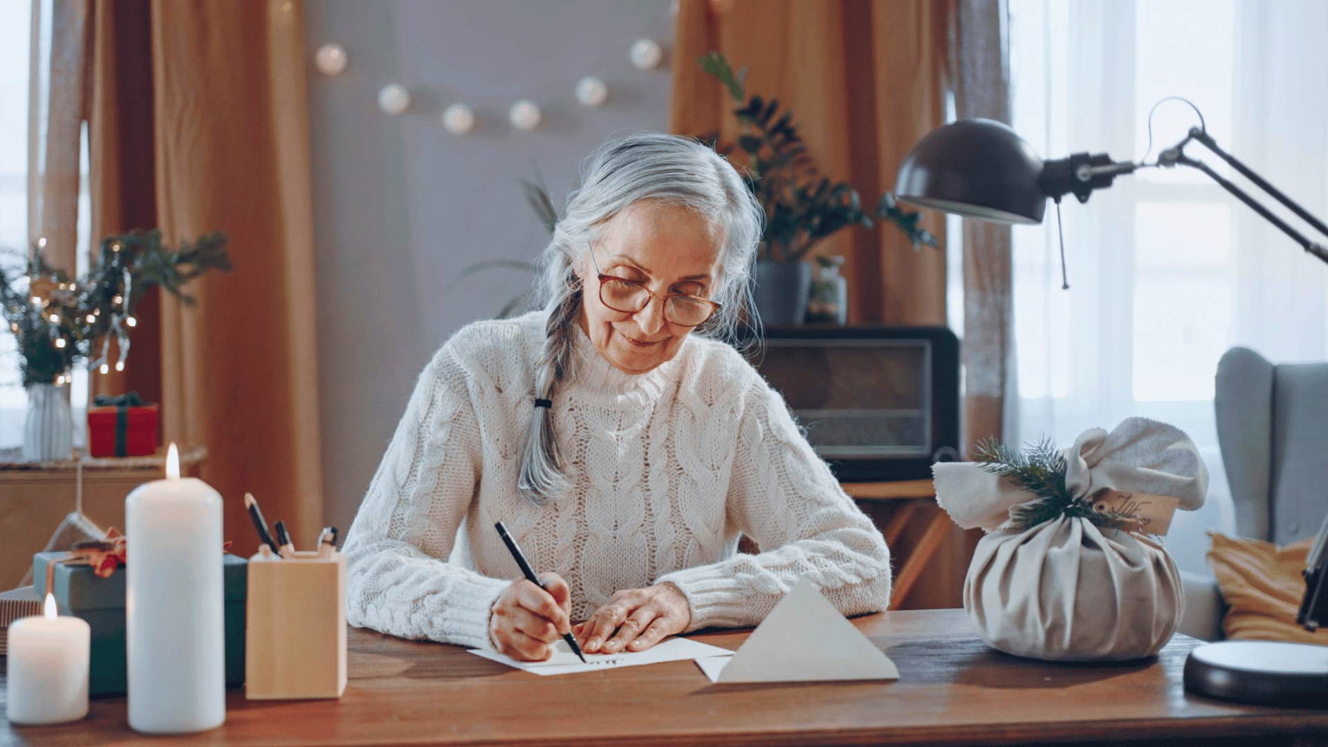 older woman writing a love letter regretting having a fear of rejection