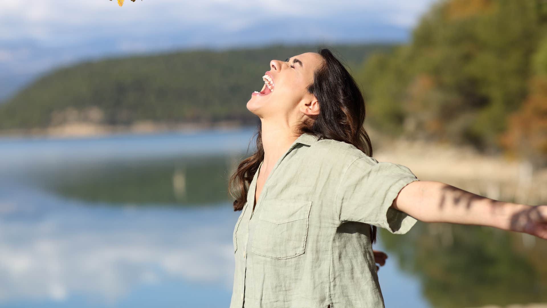 person laughs hugely showing stress released