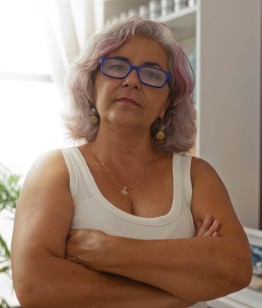 confident older person crosses arms showing safe space for self