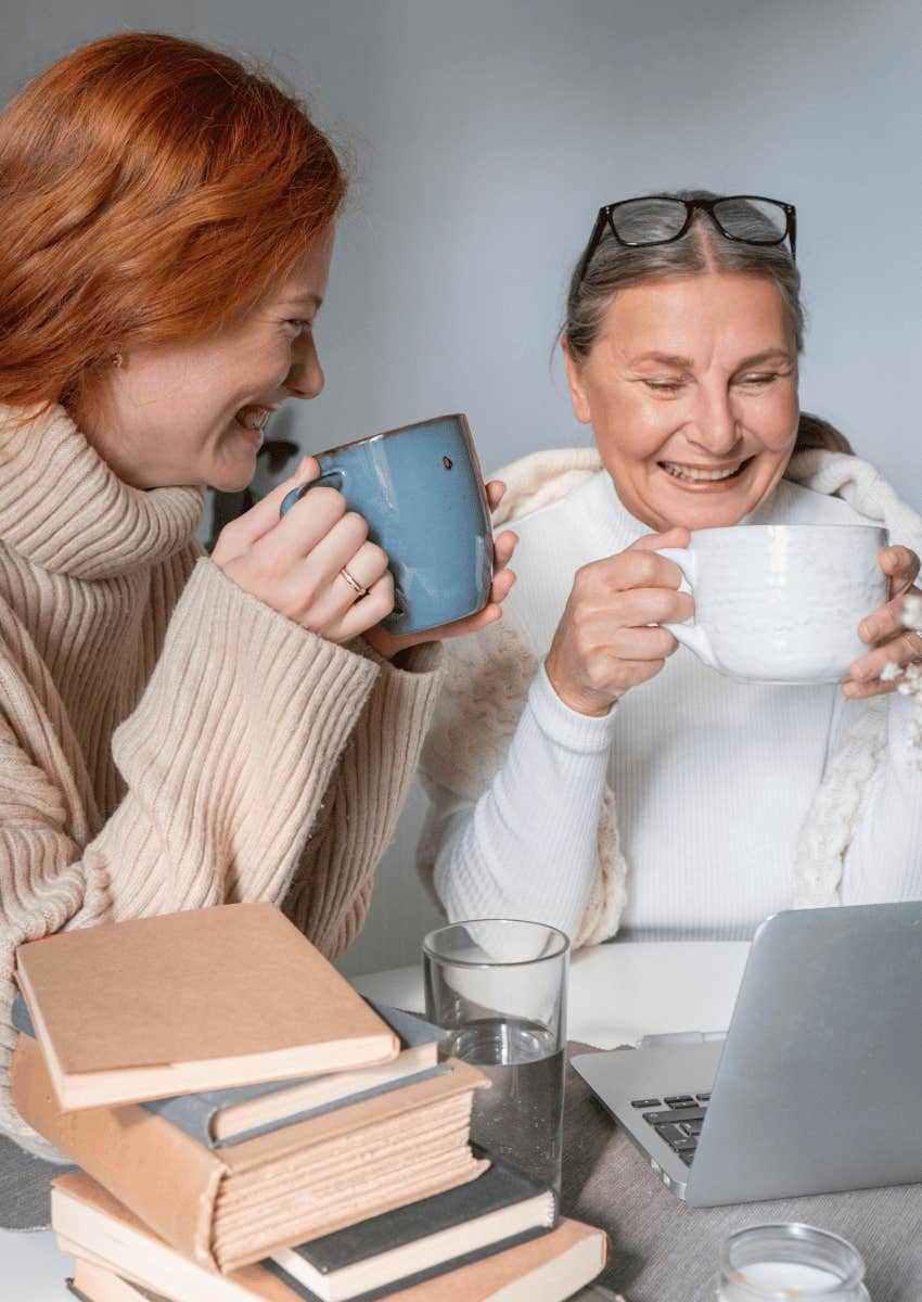 truly happy older woman laughing together with younger woman