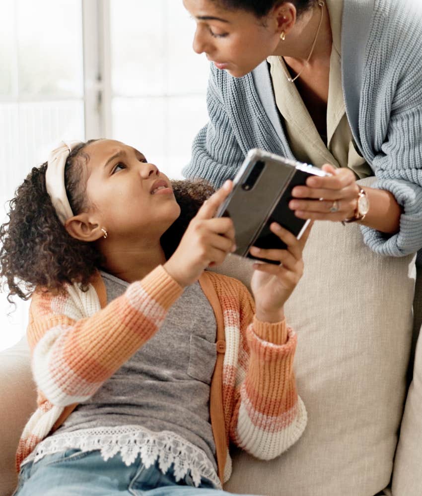 Parent takes screen away from upset child