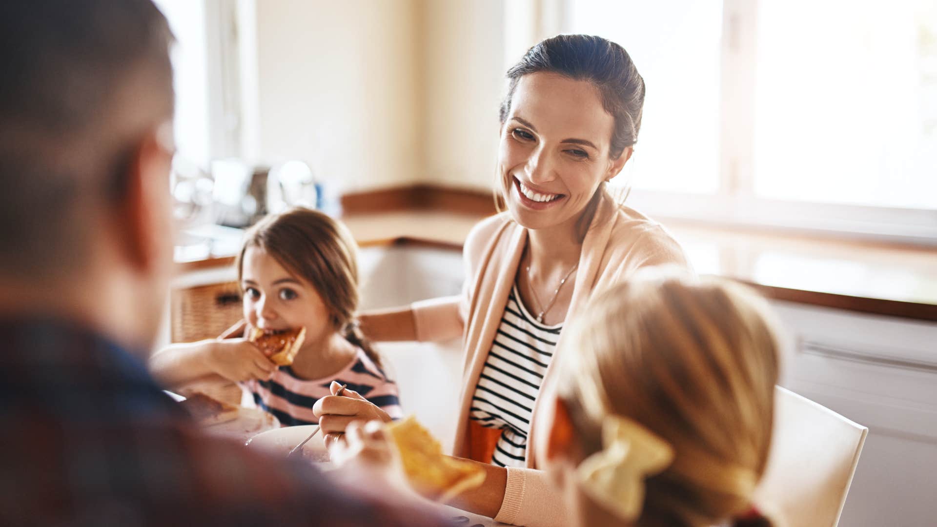 mom smiling and eating with kids planning every free minute