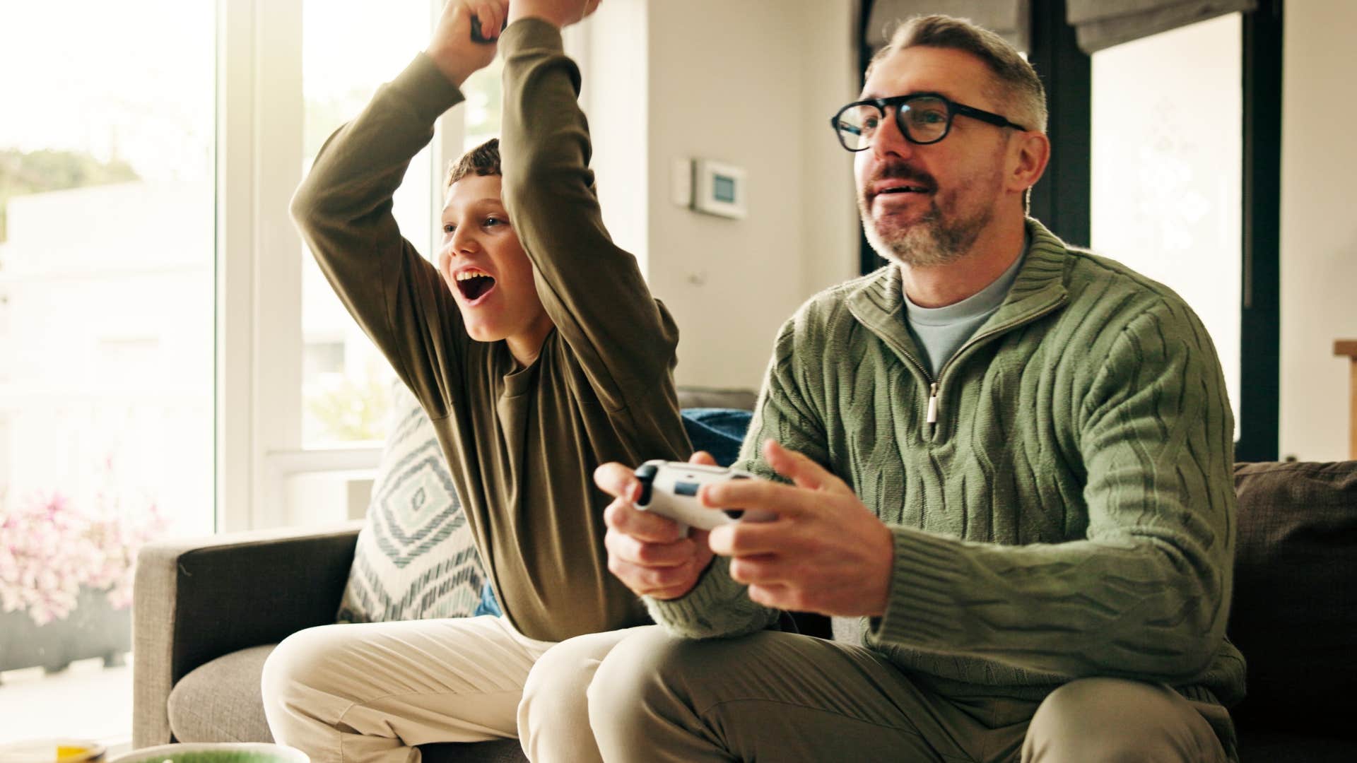 dad entertaining kids at home constantly with video games