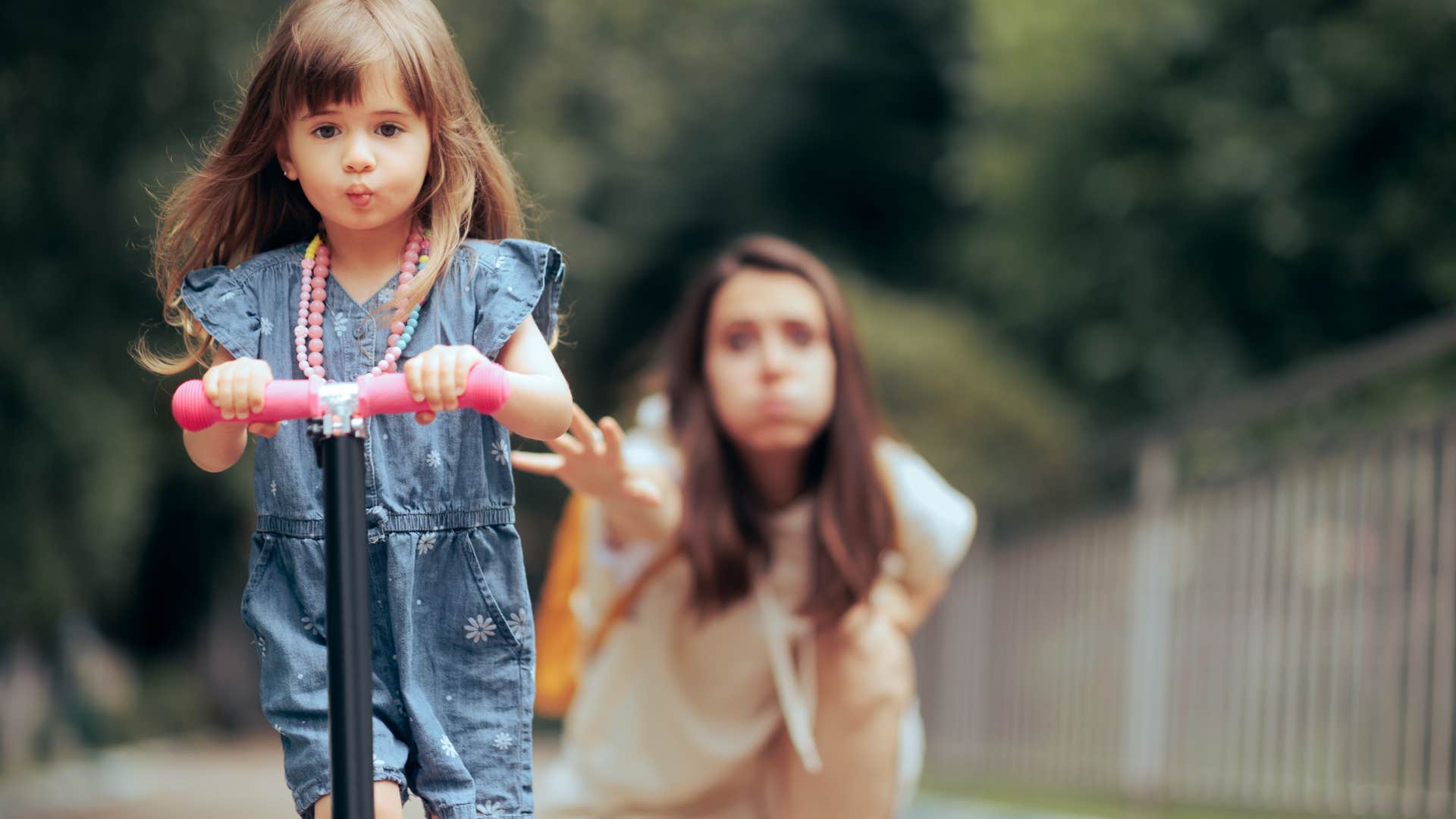 independent kid on scooter showing worried parent